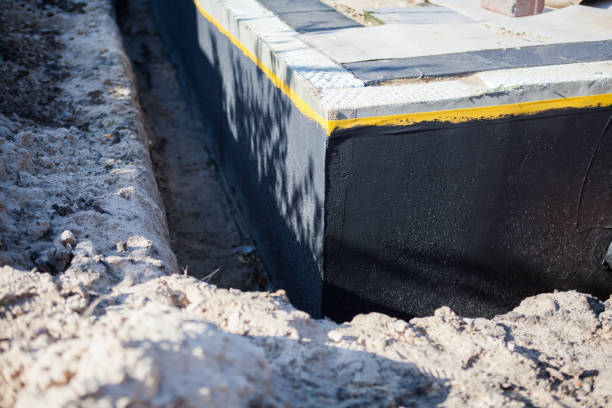 Professional Basement Waterproofing technician working in Naperville, IL